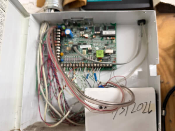 Commercial alarm control board and field wiring inside an enclosure