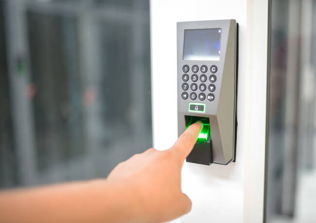 Commercial access control reader on an office door in Dallas