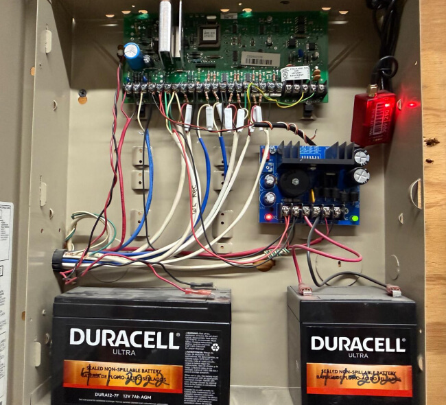 Commercial alarm panel taken over and reprogrammed with backup batteries in Dallas