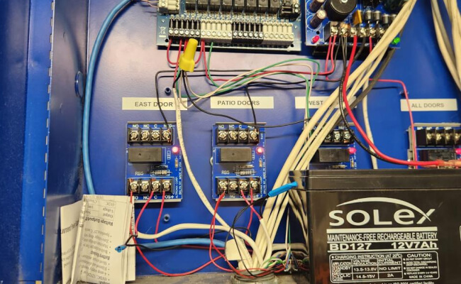Existing commercial access control panel and backup battery in Dallas