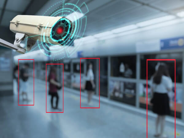 Security camera spotting a person, connected into one integrated security system in Dallas
