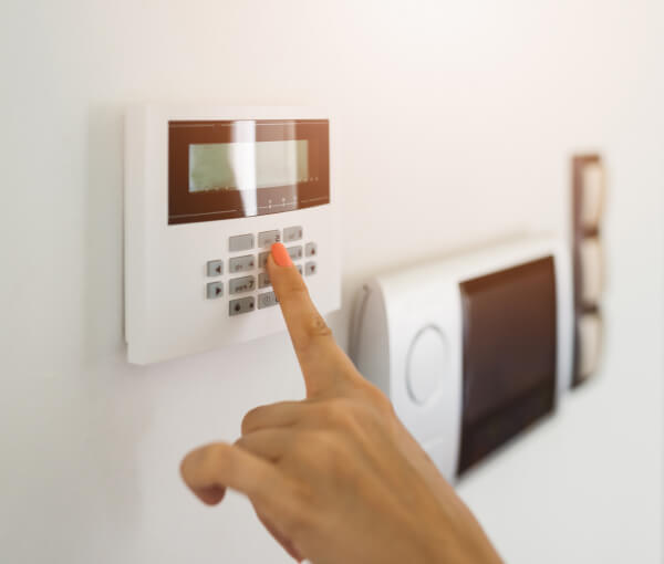 Entering a code on an existing home alarm keypad panel