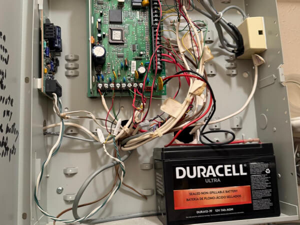 open-commercial-security-control-panel-wiring-backup-battery-img Open commercial security control panel with wiring and backup battery