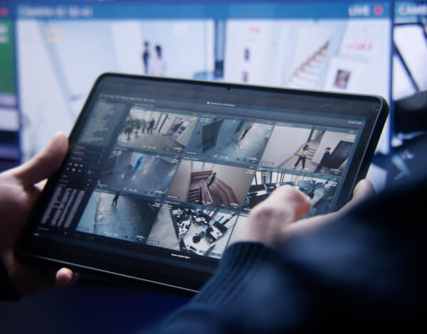 reviewing-recorded-security-camera-footage-control-room-tablet-img Reviewing recorded camera footage on a control-room tablet