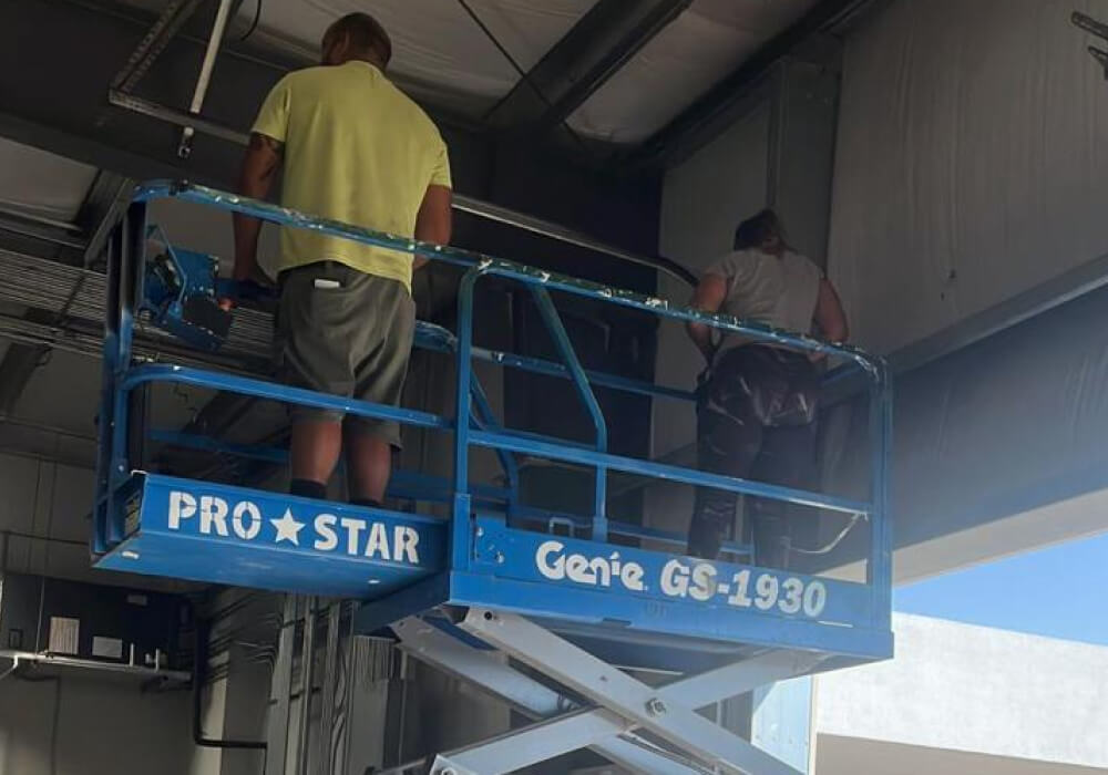 Technicians installing commercial security cameras in Dallas