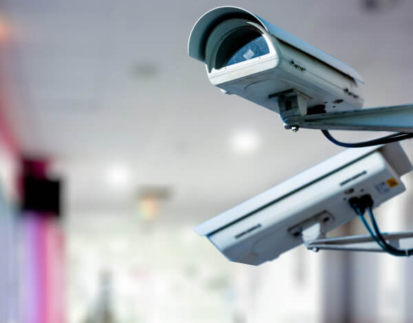 two-commercial-security-cameras-indoor-bracket-img Two commercial security cameras mounted on an indoor bracket